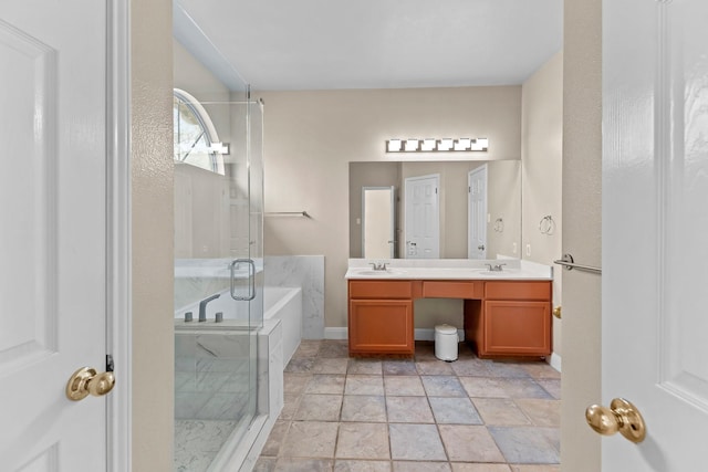 bathroom featuring vanity and shower with separate bathtub