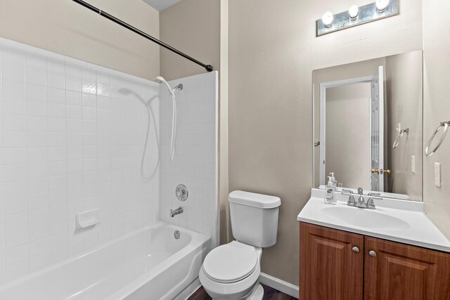 full bathroom with toilet, vanity, and bathtub / shower combination