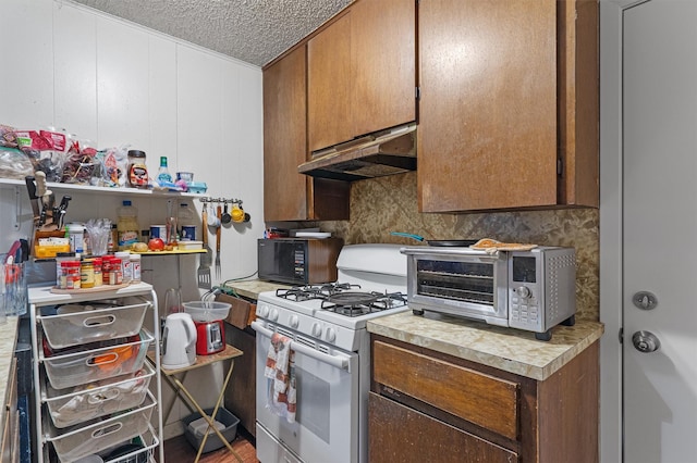 kitchen featuring white gas range oven