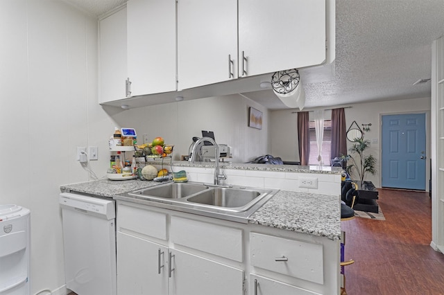 kitchen with white cabinets, dark wood-type flooring, dishwasher, and sink