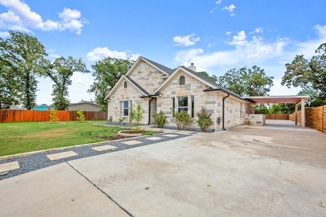 view of front of home featuring a patio area and a front lawn