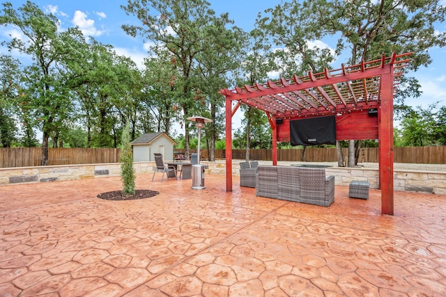 view of patio / terrace featuring a pergola, an outdoor living space, and a storage shed