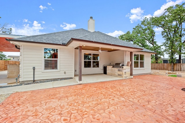 back of house with ceiling fan, a patio, and area for grilling