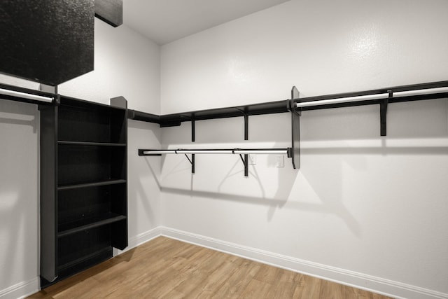 walk in closet featuring hardwood / wood-style floors