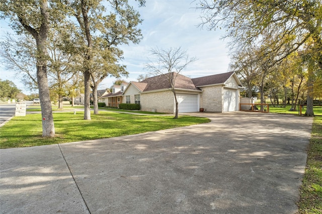 view of front of home with a front lawn and a garage