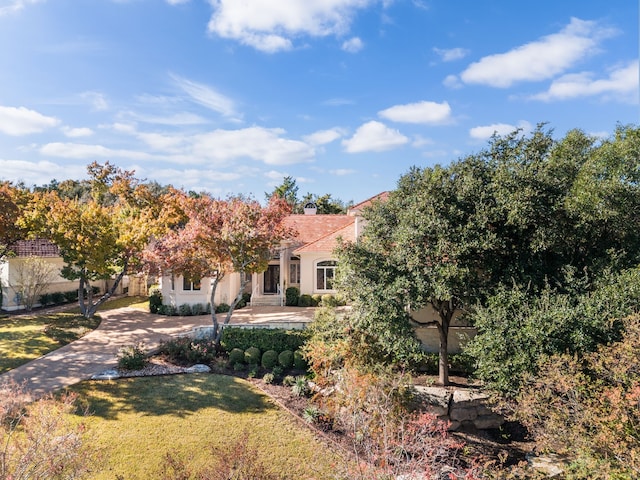 exterior space featuring a front lawn