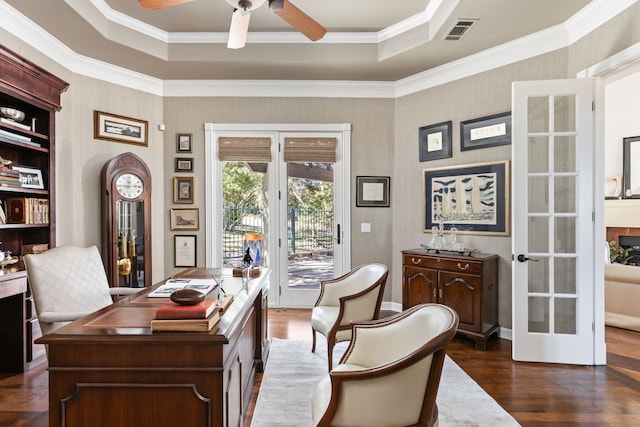 home office featuring a raised ceiling, french doors, crown molding, and dark hardwood / wood-style flooring