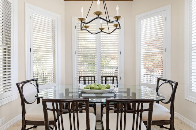 dining room with a chandelier and a wealth of natural light