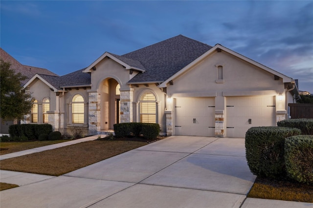 ranch-style house featuring a garage