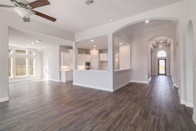 unfurnished living room featuring ceiling fan