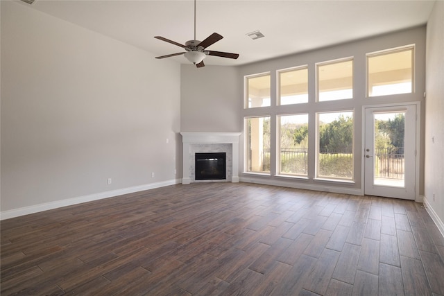 unfurnished living room with ceiling fan