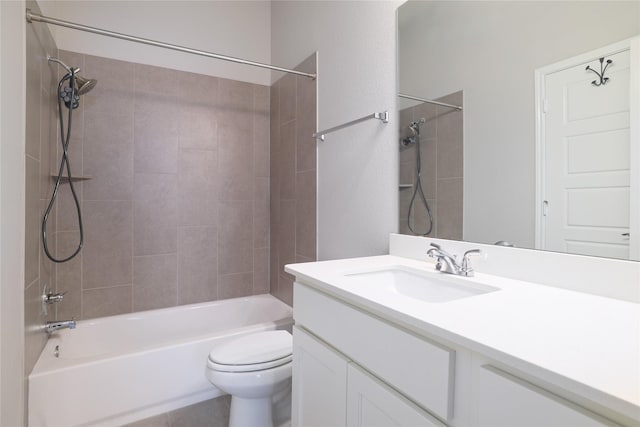 full bathroom featuring toilet, vanity, and tiled shower / bath combo