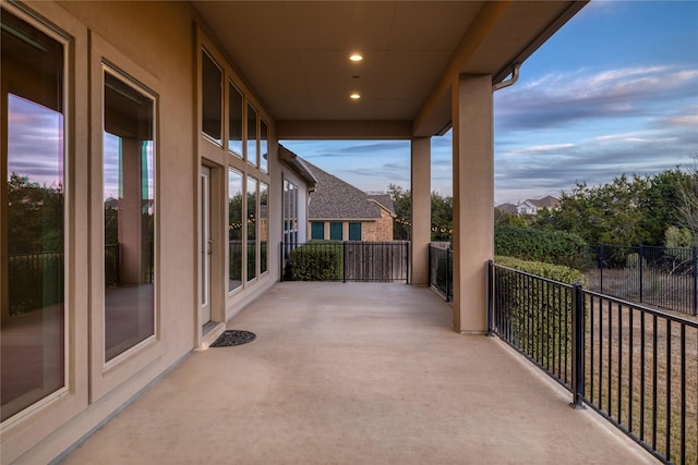 view of patio terrace at dusk