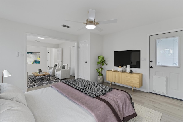 bedroom with ceiling fan and hardwood / wood-style floors