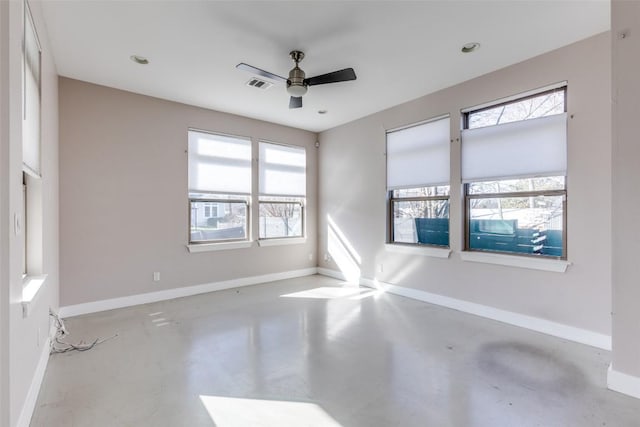 2912 E 14th St Unit A, Austin, TX 78702 - unfurnished room with concrete flooring, plenty of natural light, a ceiling fan, baseboards, and recessed lighting