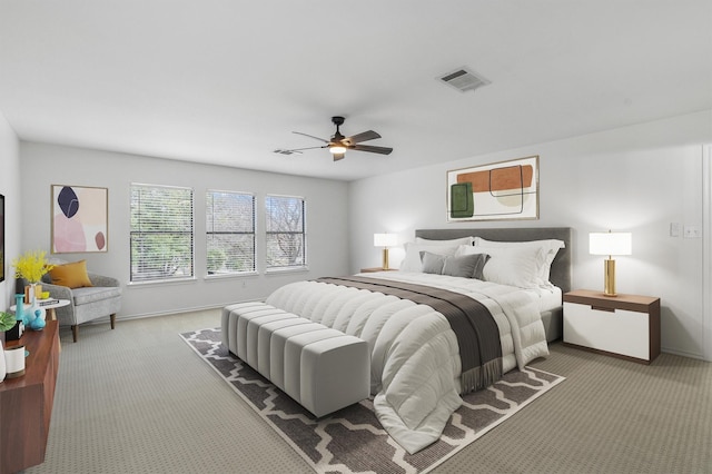 bedroom featuring ceiling fan and light colored carpet