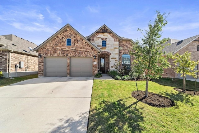 view of front of home featuring a garage and a front lawn