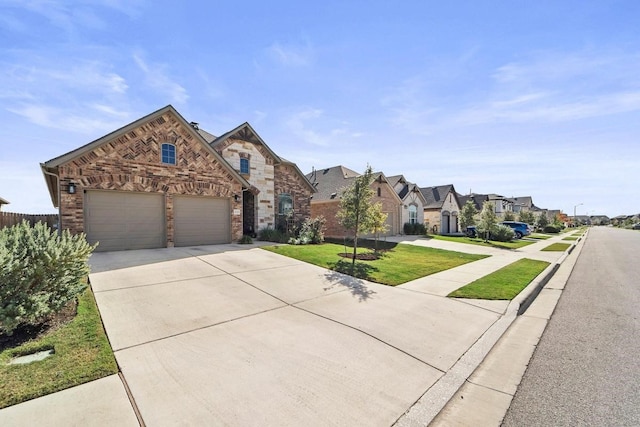 view of front of house featuring a front yard and a garage