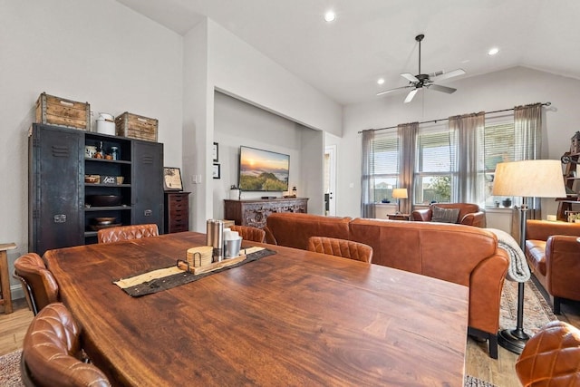 dining space featuring vaulted ceiling, ceiling fan, and light hardwood / wood-style floors