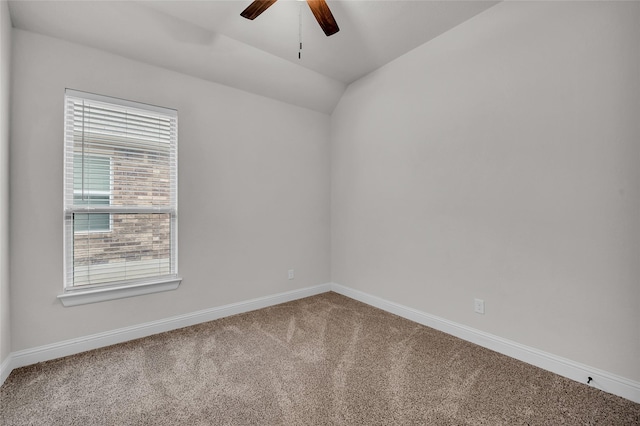 spare room featuring carpet floors, ceiling fan, and lofted ceiling