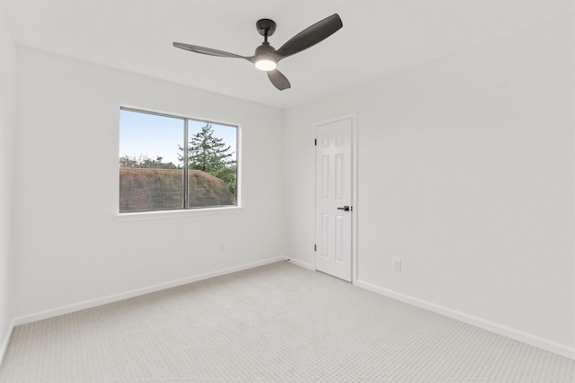 spare room with carpet flooring and ceiling fan