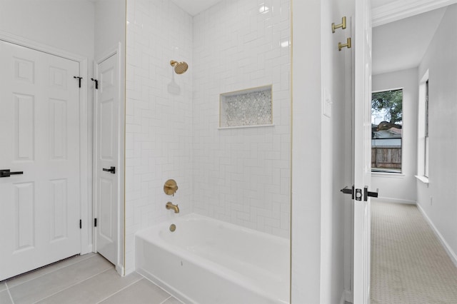 bathroom with tile patterned flooring and tiled shower / bath