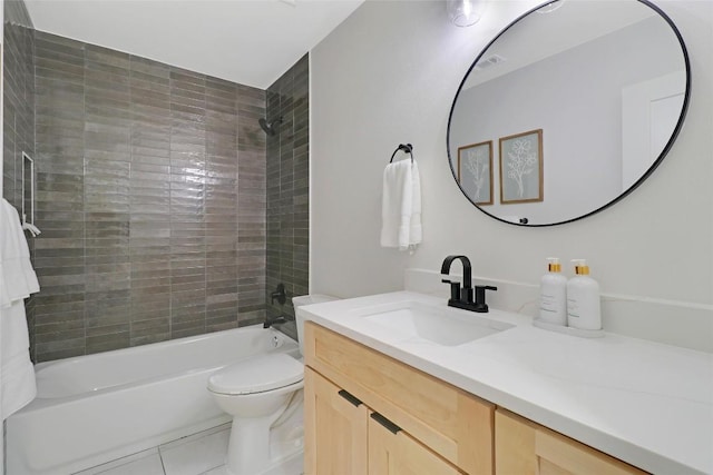 bathroom featuring shower / washtub combination, vanity, toilet, and tile patterned floors