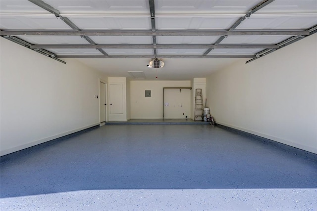 garage featuring baseboards and a garage door opener