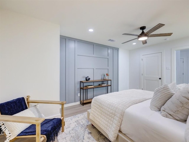 bedroom with recessed lighting, visible vents, ceiling fan, and light wood-style flooring