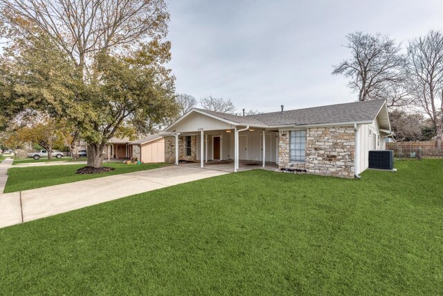 ranch-style home with central air condition unit and a front yard