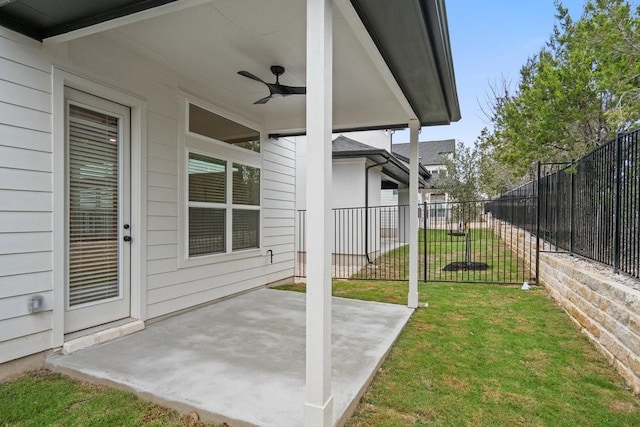 view of yard with a patio and ceiling fan