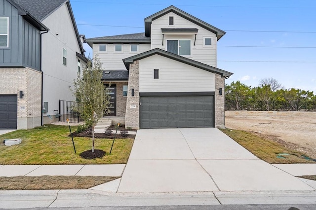 view of front of property with a garage and a front yard