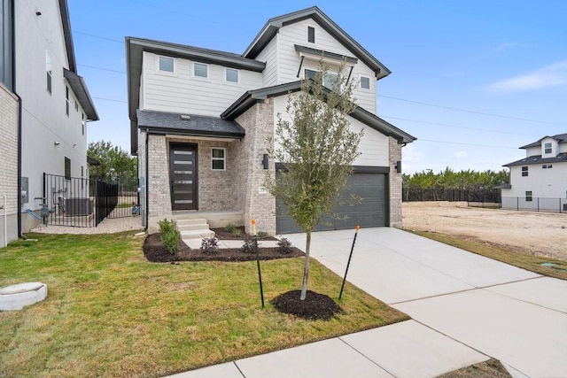 view of front of home with a garage and a front yard