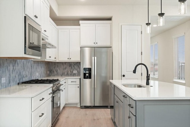 kitchen featuring white cabinetry, appliances with stainless steel finishes, and sink