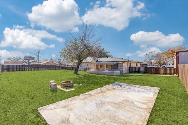 view of yard featuring a fire pit and a patio area