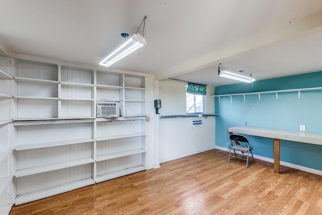 basement with hardwood / wood-style floors and cooling unit