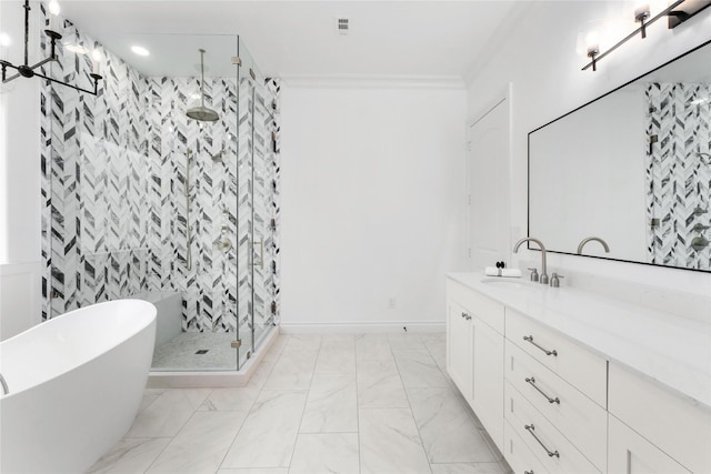 bathroom with crown molding, vanity, and plus walk in shower