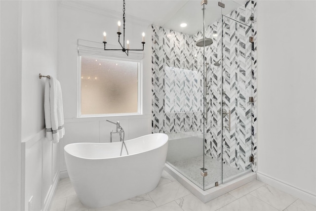 bathroom featuring a notable chandelier and independent shower and bath