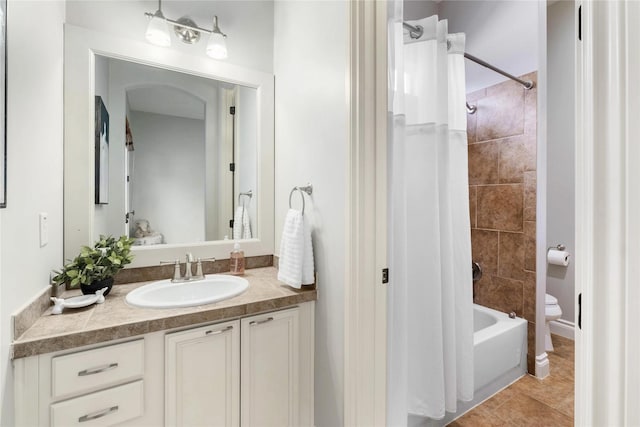 full bathroom with vanity, toilet, tile patterned flooring, and shower / bath combo