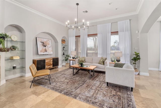 living room featuring ornamental molding, a chandelier, and built in shelves