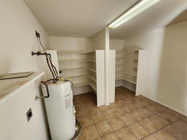 utility room with electric water heater