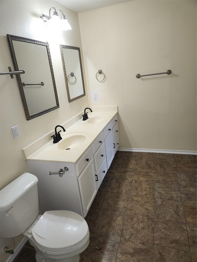 bathroom with toilet and vanity