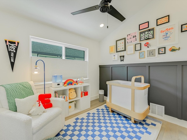 bedroom featuring vaulted ceiling, ceiling fan, and light hardwood / wood-style floors