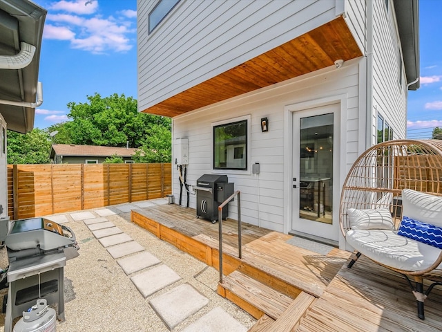 view of patio / terrace with a wooden deck and area for grilling