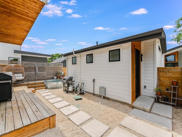 rear view of property with a wooden deck