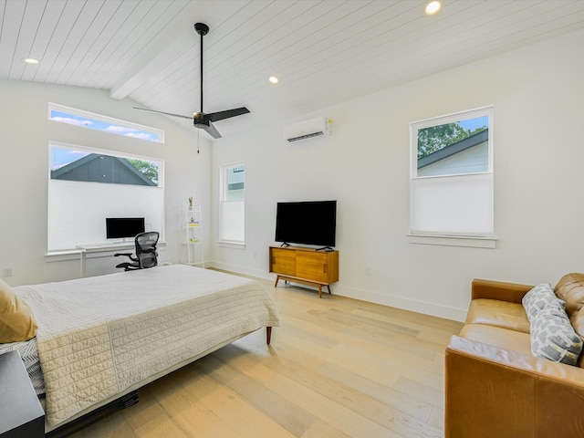 bedroom with multiple windows, a wall unit AC, light hardwood / wood-style flooring, and vaulted ceiling with beams