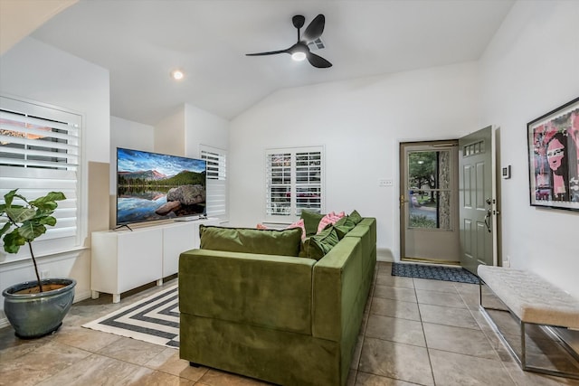 tiled living room with lofted ceiling and ceiling fan