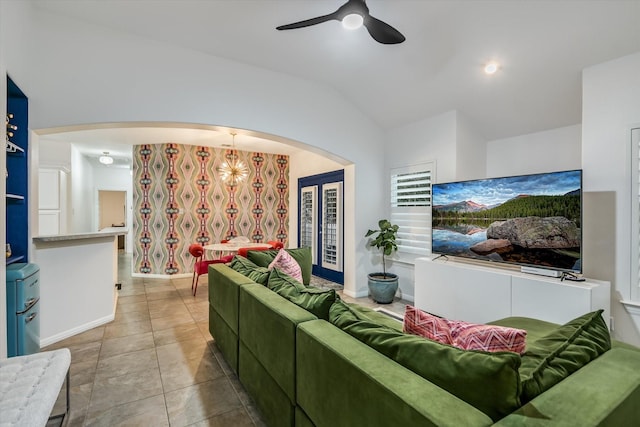 tiled living room with vaulted ceiling and ceiling fan