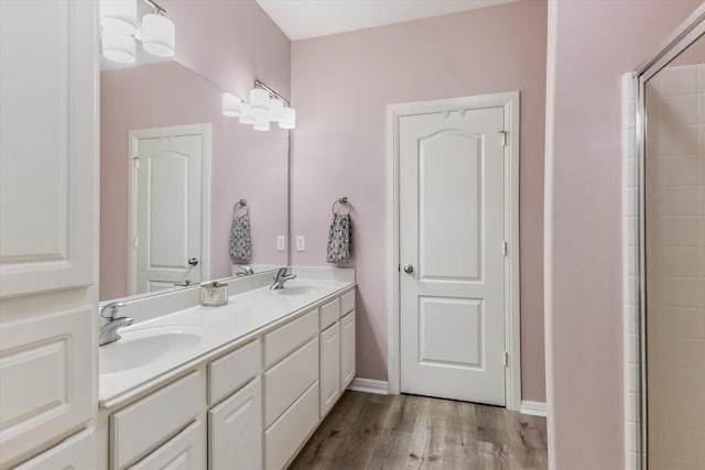 bathroom featuring wood-type flooring and vanity