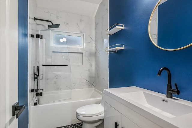 full bathroom with toilet, vanity, and tiled shower / bath combo